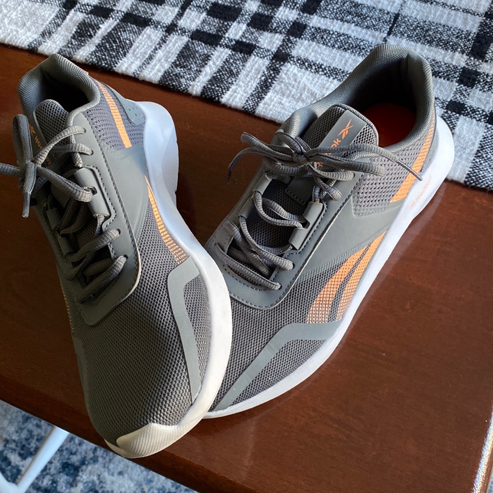 Brand new, never worn outside. Reebok gray and peachy orange trainers.